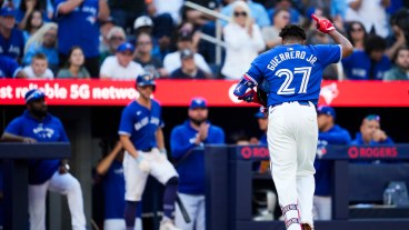 TORONTO, ON - SEPTEMBER 29: Vladimir Guerrero Jr. #27 of the Toronto Blue Jays salutes the crowd while coming out of the game after drawing a walk for his last at bat of the season, against the Miami Marlins, in their MLB game at the Rogers Centre on September 29, 2024 in Toronto, Ontario, Canada. (Photo by Mark Blinch/Getty Images)
