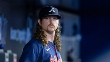 Grant Holmes of the Atlanta Braves looks on from the dugout during the game between the Atlanta Braves and the Miami Marlins at loanDepot park.