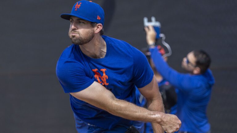 New York Mets pitcher Clay Holmes throws during a spring training workout.