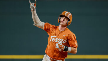 Texas outfielder Max Belyeu holds up the Hook 'Em Horns sign after hitting a home run during the 2024 Phillips 66 Big 12 Baseball Championship game between Texas and Cincinnati.