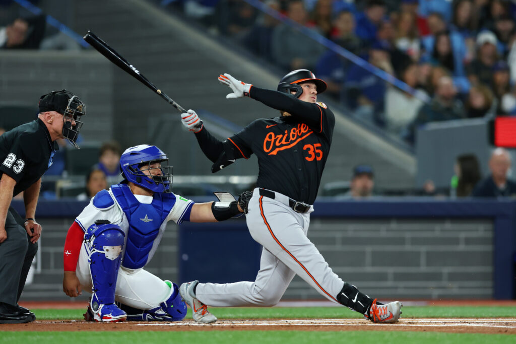 TORONTO, ONTARIO - MARCH 27: Adley Rutschman #35 of the Baltimore Orioles reacts after hitting a home run against the Toronto Blue Jays during the first inning on Opening Day at Rogers Centre on March 27, 2025 in Toronto, Ontario. (Photo by Vaughn Ridley/Getty Images)