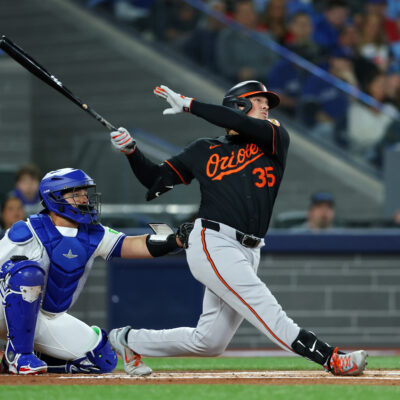 TORONTO, ONTARIO - MARCH 27: Adley Rutschman #35 of the Baltimore Orioles reacts after hitting a home run against the Toronto Blue Jays during the first inning on Opening Day at Rogers Centre on March 27, 2025 in Toronto, Ontario. (Photo by Vaughn Ridley/Getty Images)