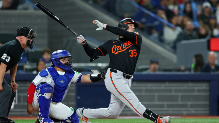 TORONTO, ONTARIO - MARCH 27: Adley Rutschman #35 of the Baltimore Orioles reacts after hitting a home run against the Toronto Blue Jays during the first inning on Opening Day at Rogers Centre on March 27, 2025 in Toronto, Ontario. (Photo by Vaughn Ridley/Getty Images)