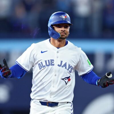 Andrés Giménez of the Toronto Blue Jays jogs around the bases after hitting a two-run home run against the Baltimore Orioles during the fourth inning on Opening Day at Rogers Centre.
