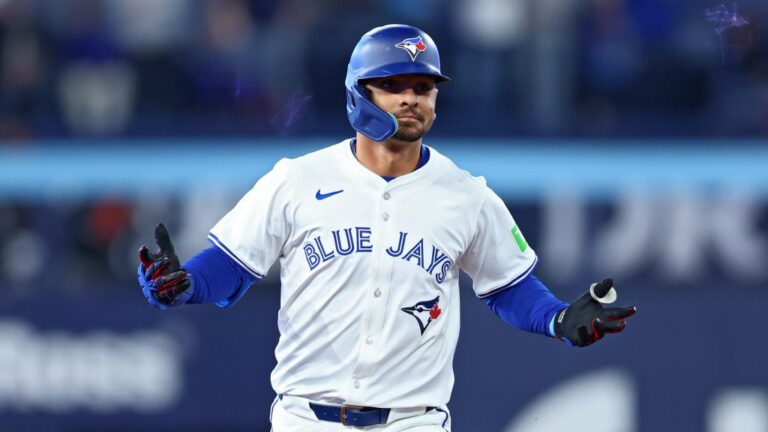 Andrés Giménez of the Toronto Blue Jays jogs around the bases after hitting a two-run home run against the Baltimore Orioles during the fourth inning on Opening Day at Rogers Centre.