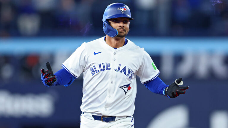 Andrés Giménez of the Toronto Blue Jays jogs around the bases after hitting a two-run home run against the Baltimore Orioles during the fourth inning on Opening Day at Rogers Centre.