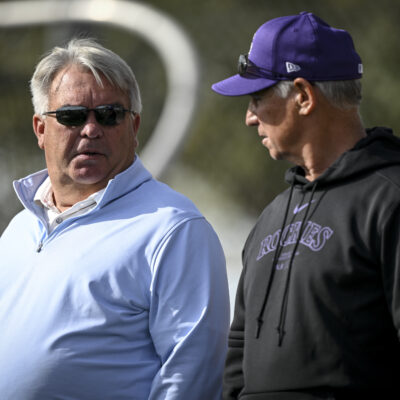 Colorado Rockies general manager Bill Schmidt and manager Bud Black watch outfielders and infielders perform drills during Spring Training at Salt River Fields in Scottsdale, Arizona.