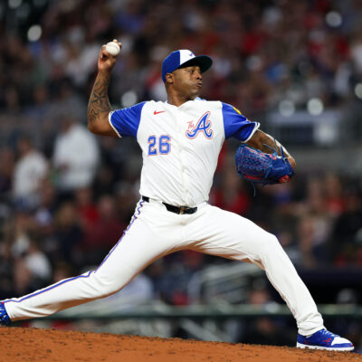 Raisel Iglesias of the Atlanta Braves delivers a pitch during the ninth inning against the Kansas City Royals at Truist Park.