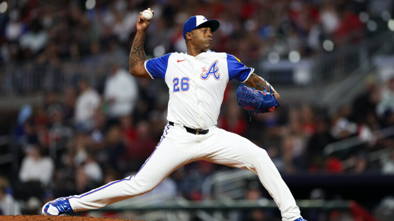 Raisel Iglesias of the Atlanta Braves delivers a pitch during the ninth inning against the Kansas City Royals at Truist Park.