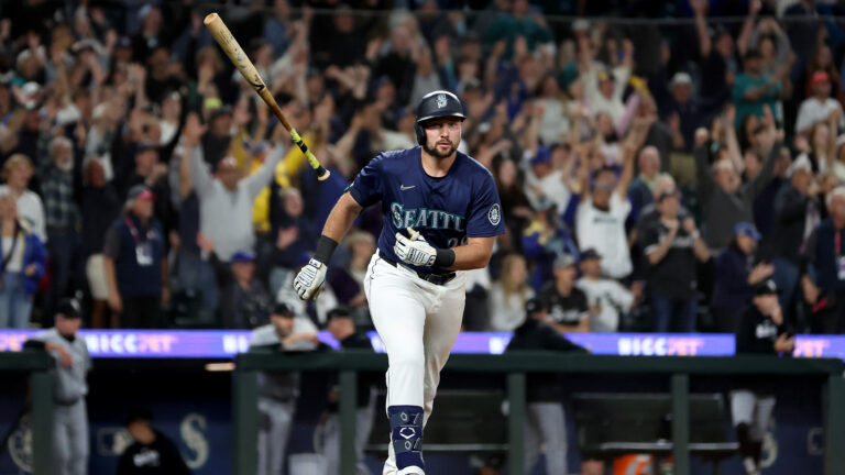 Cal Raleigh of the Seattle Mariners celebrates his walk-off grand slam to beat the Chicago White Sox at T-Mobile Park.