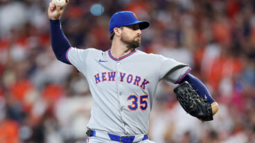 Clay Holmes of the New York Mets pitches against the Houston Astros during the first inning on Opening Day at Daikin Park.