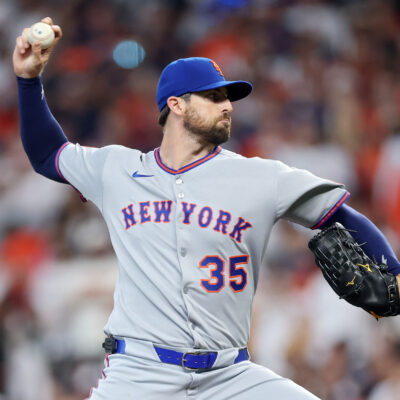 Clay Holmes of the New York Mets pitches against the Houston Astros during the first inning on Opening Day at Daikin Park.