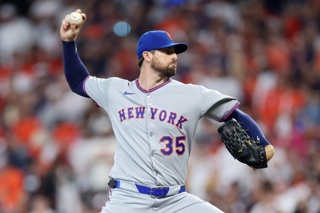 Clay Holmes of the New York Mets pitches against the Houston Astros during the first inning on Opening Day at Daikin Park.