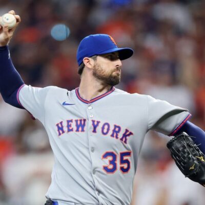 Clay Holmes of the New York Mets pitches against the Houston Astros during the first inning on Opening Day at Daikin Park.