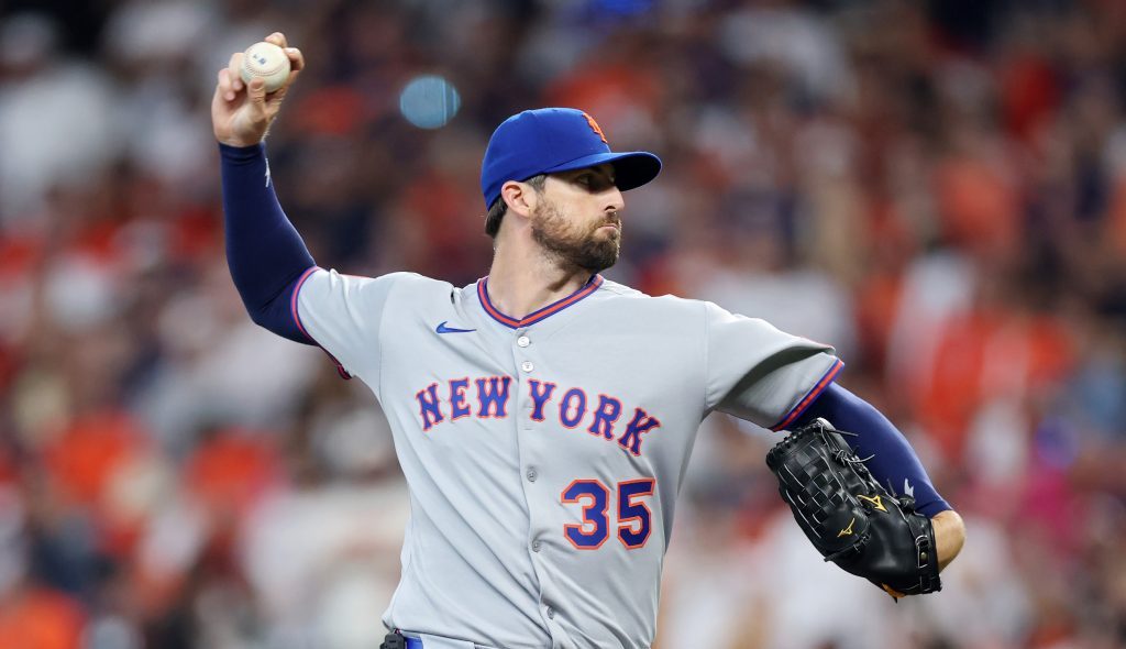 Clay Holmes of the New York Mets pitches against the Houston Astros during the first inning on Opening Day at Daikin Park.