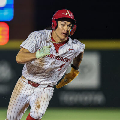 Arkansas infielder Wehiwa Aloy runs to third base in the NCAA regional game between the Arkansas Razorbacks and the Kansas State Wildcats.