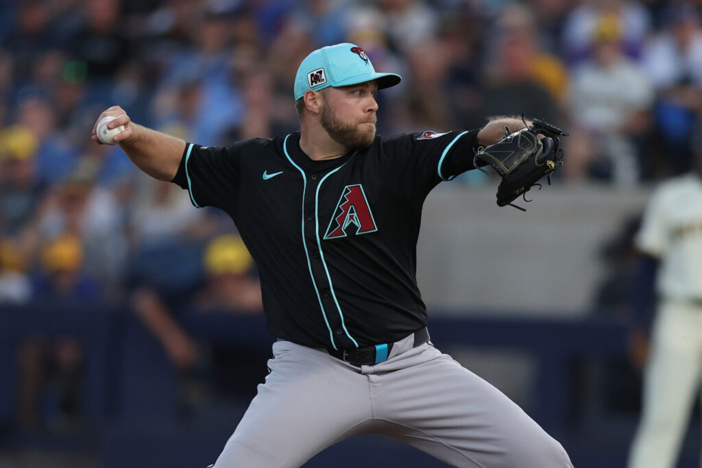 Corbin Burnes of the Arizona Diamondbacks pitches in the first inning during the spring training game against the Milwaukee Brewers at American Family Field of Phoenix.