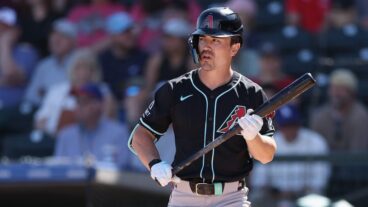Corbin Carroll of the Arizona Diamondbacks bats against the Texas Rangers during the first inning of the MLB game at Surprise Stadium.