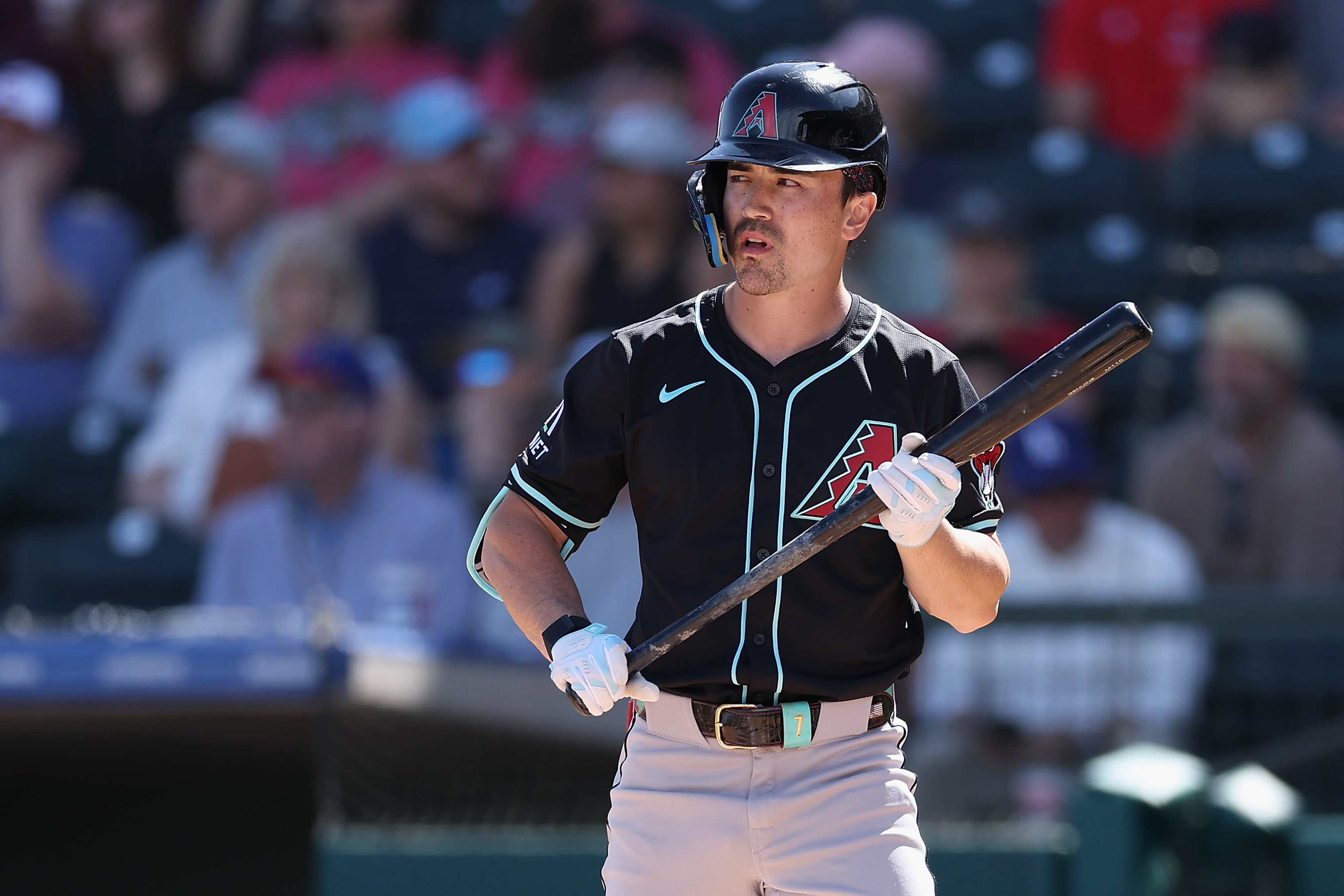 Corbin Carroll of the Arizona Diamondbacks bats against the Texas Rangers during the first inning of the MLB game at Surprise Stadium.