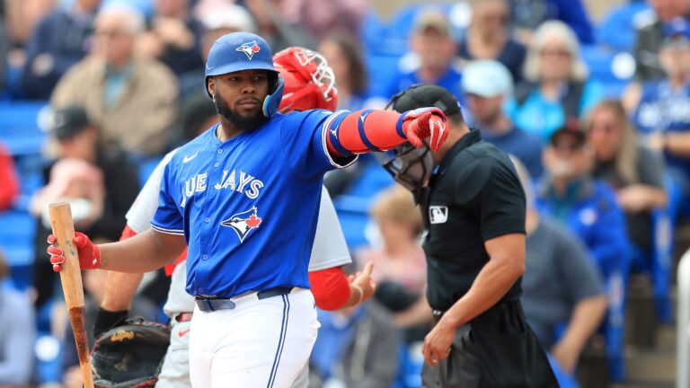 DUNEDIN, FL - FEBRUARY 25: Toronto Blue Jays DH Vladimir Guerrero Jr. (27) points at a friend in the St. Louis dugout during the spring training game between the St. Louis Cardinals and the Toronto Blue Jays on February 25, at the TD Ballpark in Dunedin, FL. (Photo by Cliff Welch/Icon Sportswire via Getty Images)
