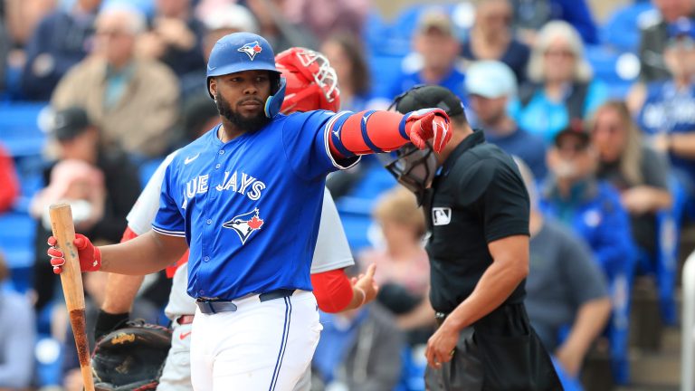 DUNEDIN, FL - FEBRUARY 25: Toronto Blue Jays DH Vladimir Guerrero Jr. (27) points at a friend in the St. Louis dugout during the spring training game between the St. Louis Cardinals and the Toronto Blue Jays on February 25, at the TD Ballpark in Dunedin, FL. (Photo by Cliff Welch/Icon Sportswire via Getty Images)