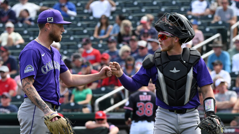 GOODYEAR, AZ - FEBRUARY 28: Kyle Freeland #21 and Hunter Goodman #15 of the Colorado Rockies celebrate after an inning during the game between the Colorado Rockies and the Cleveland Guardians at Goodyear Ballpark on Friday, February 28, 2025 in Goodyear, Arizona. (Photo by Caitlin O'Hara/MLB Photos via Getty Images)