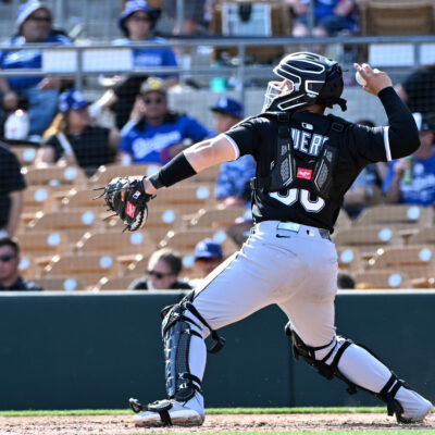 Edgar Quero of the Chicago White Sox warms up during the seventh inning of a spring training game against the Los Angeles Dodgers at Camelback Ranch.