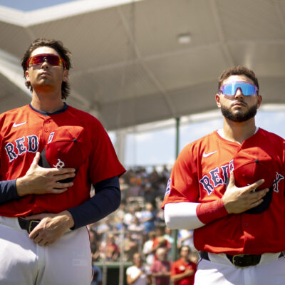 FORT MYERS, FLORIDA - MARCH 15: (L-R) Triston Casas #36 and Wilyer Abreu #52 of the Boston Red Sox look on during the National Anthem before a game against the Atlanta Braves at JetBlue Park at Fenway South in Fort Myers, Florida on March 15, 2025. (Photo by Maddie Malhotra/Boston Red Sox/Getty Images)