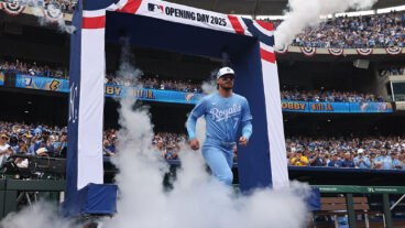 KANSAS CITY, MO - MARCH 27: Kansas City Royals shortstop Bobby Witt Jr. (7) runs through smoke as he is introduced before an Opening Day MLB game between the Cleveland Guardians and Kansas City Royals on March 27, 2025 at Kauffman Stadium in Kansas City, MO. (Photo by Scott Winters/Icon Sportswire via Getty Images)
