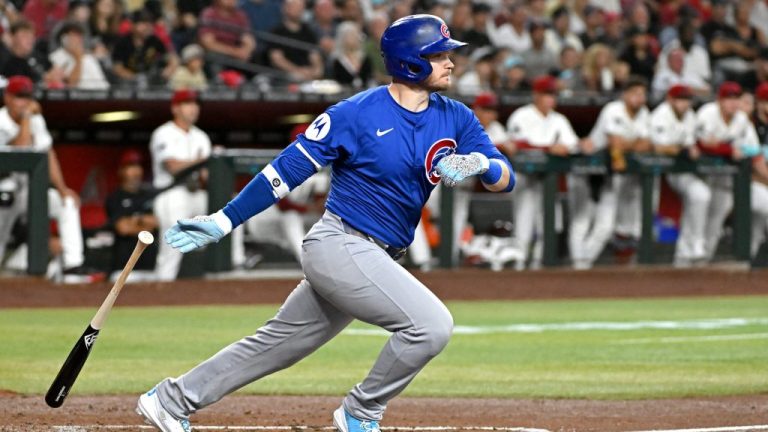 PHOENIX, ARIZONA - MARCH 27: Ian Happ #8 of the Chicago Cubs hits a two-rbi double in the second inning against the Arizona Diamondbacks on Opening Day at Chase Field on March 27, 2025 in Phoenix, Arizona. (Photo by Norm Hall/Getty Images)