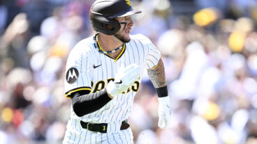 Jackson Merrill of the San Diego Padres hits a single in the first inning against the Atlanta Braves on Opening Day at Petco Park.