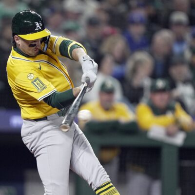 Jacob Wilson of the Athletics hits a single in the third inning against the Seattle Mariners on Opening Day at T-Mobile Park.