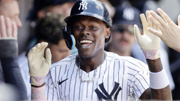 NEW YORK, NEW YORK - AUGUST 10: Jazz Chisholm Jr. #13 of the New York Yankees celebrates his eighth inning home run against the Texas Rangers in the dugout with his teammates at Yankee Stadium on August 10, 2024 in New York City. (Photo by Jim McIsaac/Getty Images)