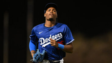 GLENDALE, ARIZONA - FEBRUARY 28, 2025: Josue De Paula #95 of the Los Angeles Dodgers runs off the field during the eighth inning of a spring training game against the Los Angeles Angels at Camelback Ranch on February 28, 2025 in Glendale, Arizona. (Photo by Chris Bernacchi/Diamond Images via Getty Images)
