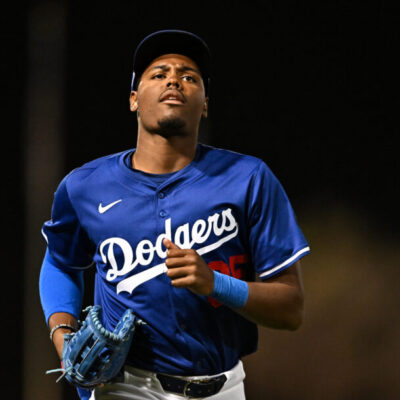 GLENDALE, ARIZONA - FEBRUARY 28, 2025: Josue De Paula #95 of the Los Angeles Dodgers runs off the field during the eighth inning of a spring training game against the Los Angeles Angels at Camelback Ranch on February 28, 2025 in Glendale, Arizona. (Photo by Chris Bernacchi/Diamond Images via Getty Images)