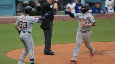 Gleyber Torres of the Detroit Tigers celebrates with Colt Keith after scoring in the fifth inning during the game between the Detroit Tigers and the Los Angeles Dodgers at Dodger Stadium.
