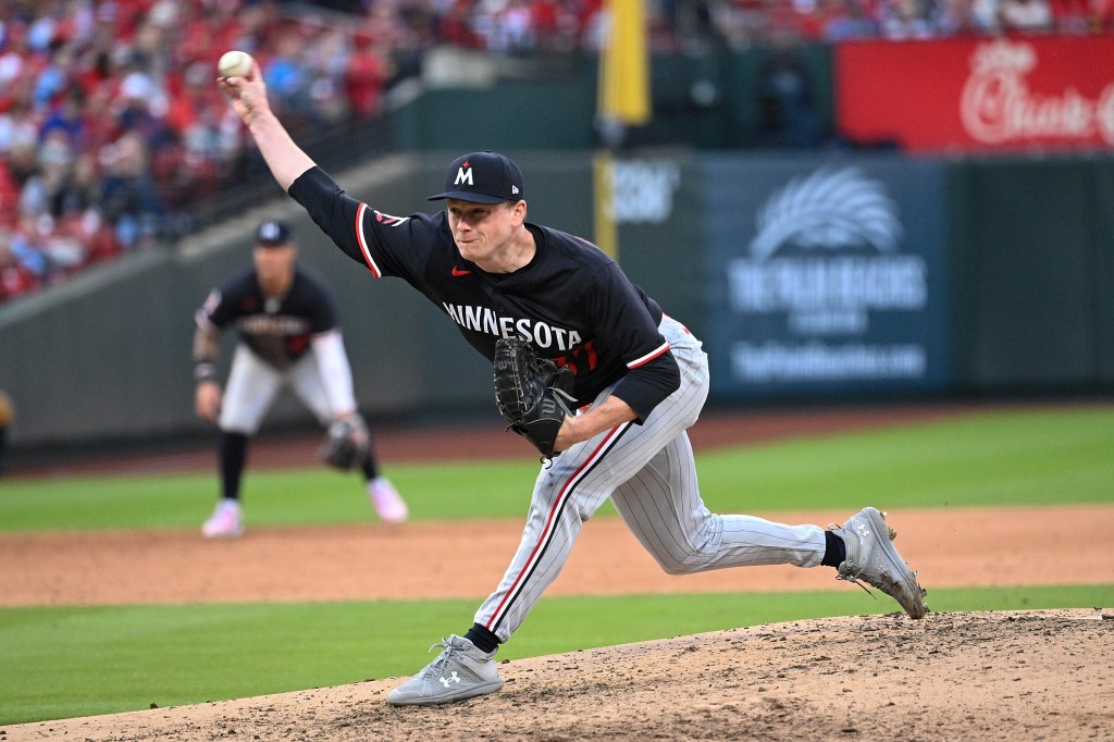 Louis Varland of the Minnesota Twins pitches against the St. Louis Cardinals in the sixth inning on Opening Day at Busch Stadium.