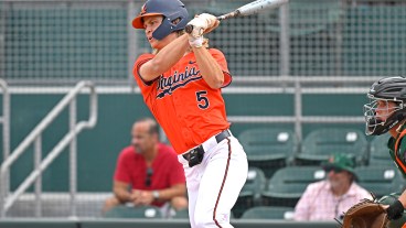 Virginia infielder Luke Hanson hits an RBI single in the fifth inning as the Miami Hurricanes faced the Virginia Cavaliers.