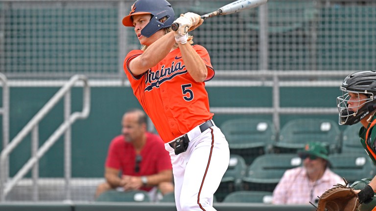Virginia infielder Luke Hanson hits an RBI single in the fifth inning as the Miami Hurricanes faced the Virginia Cavaliers.