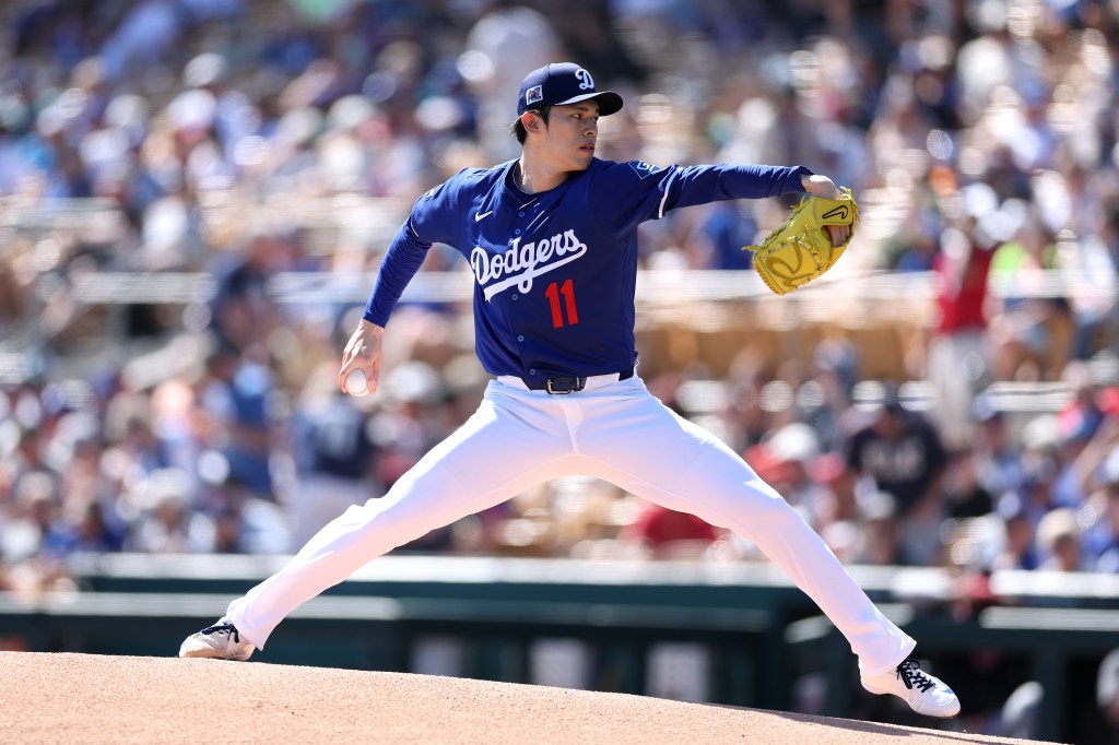 Roki Sasaki of the Los Angeles Dodgers pitches against the Cleveland Guardians during the first inning at Camelback Ranch.
