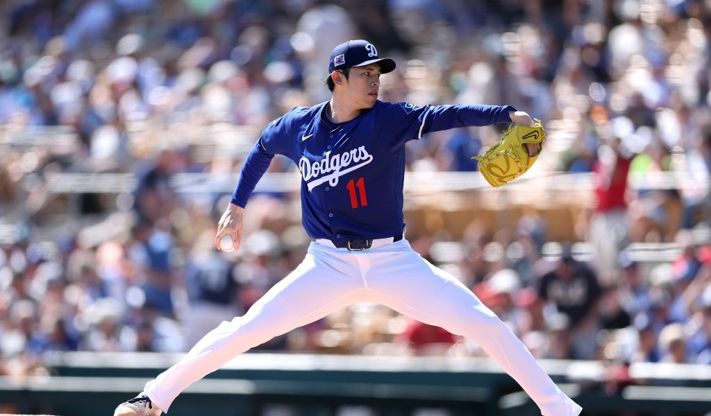 Roki Sasaki of the Los Angeles Dodgers pitches against the Cleveland Guardians during the first inning at Camelback Ranch.