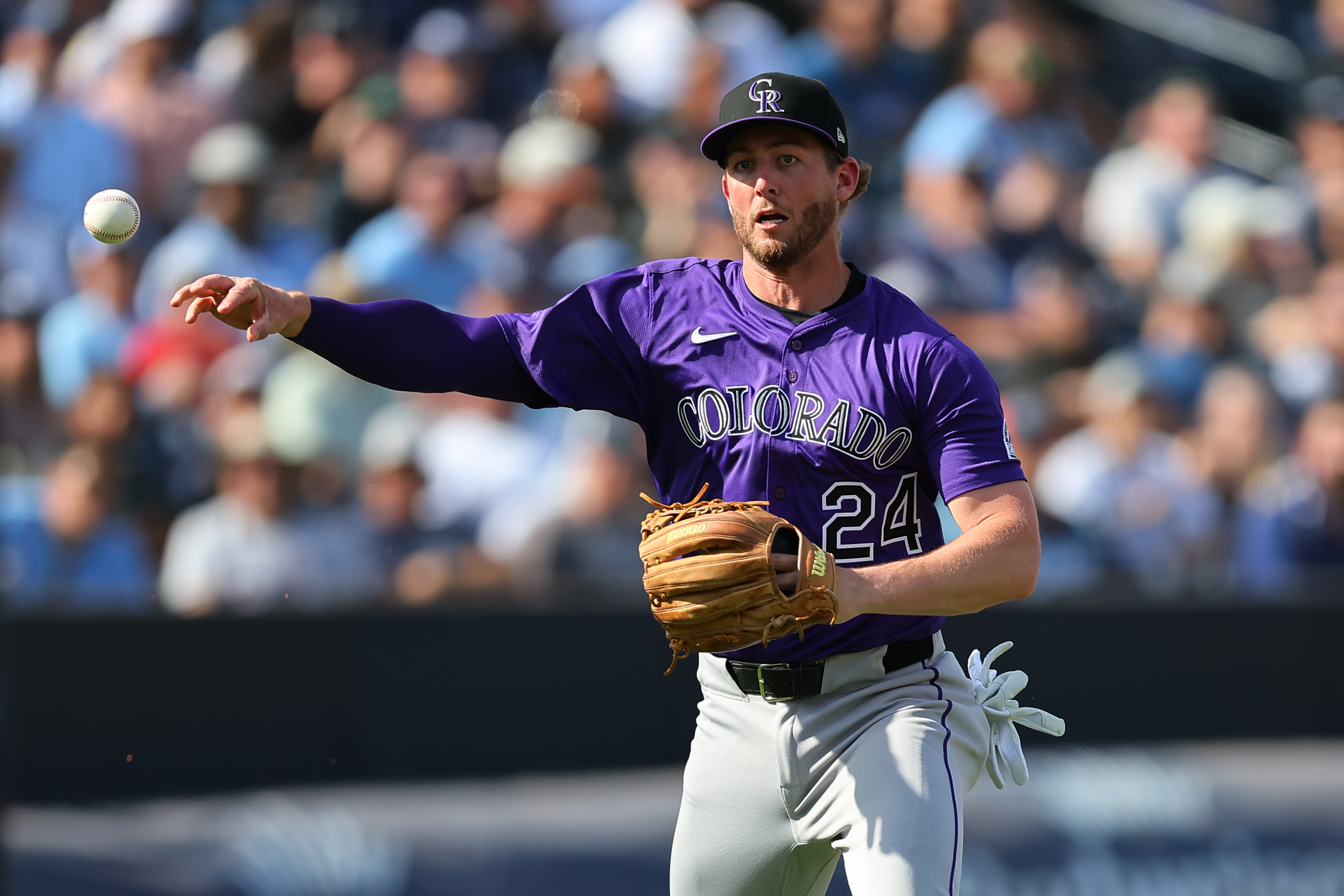 TAMPA, FL - MARCH 28: Ryan McMahon #24 of the Colorado Rockies throws during the game between the Colorado Rockies and the Tampa Bay Rays at George M. Steinbrenner Field on Friday, March 28, 2025 in Tampa, Florida. (Photo by Mike Carlson/MLB Photos via Getty Images)