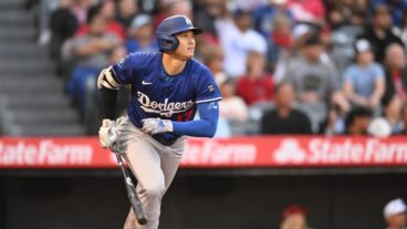 Shohei Ohtani of the Los Angeles Dodgers gets a double in the third inning in a spring training game against the Los Angeles Angels at Angel Stadium of Anaheim.