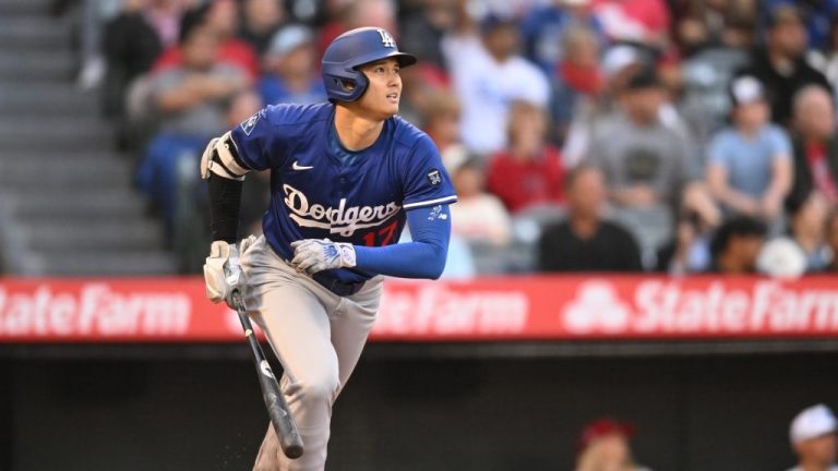 Shohei Ohtani of the Los Angeles Dodgers gets a double in the third inning in a spring training game against the Los Angeles Angels at Angel Stadium of Anaheim.