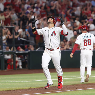 PHOENIX, AZ - MARCH 27: Eugenio Suárez #28 of the Arizona Diamondbacks celebrates as he rounds the bases after hitting a solo home run in the second inning during the game between the Chicago Cubs and the Arizona Diamondbacks at Chase Field on Thursday, March 27, 2025 in Phoenix, Arizona. (Photo by Chris Coduto/MLB Photos via Getty Images)