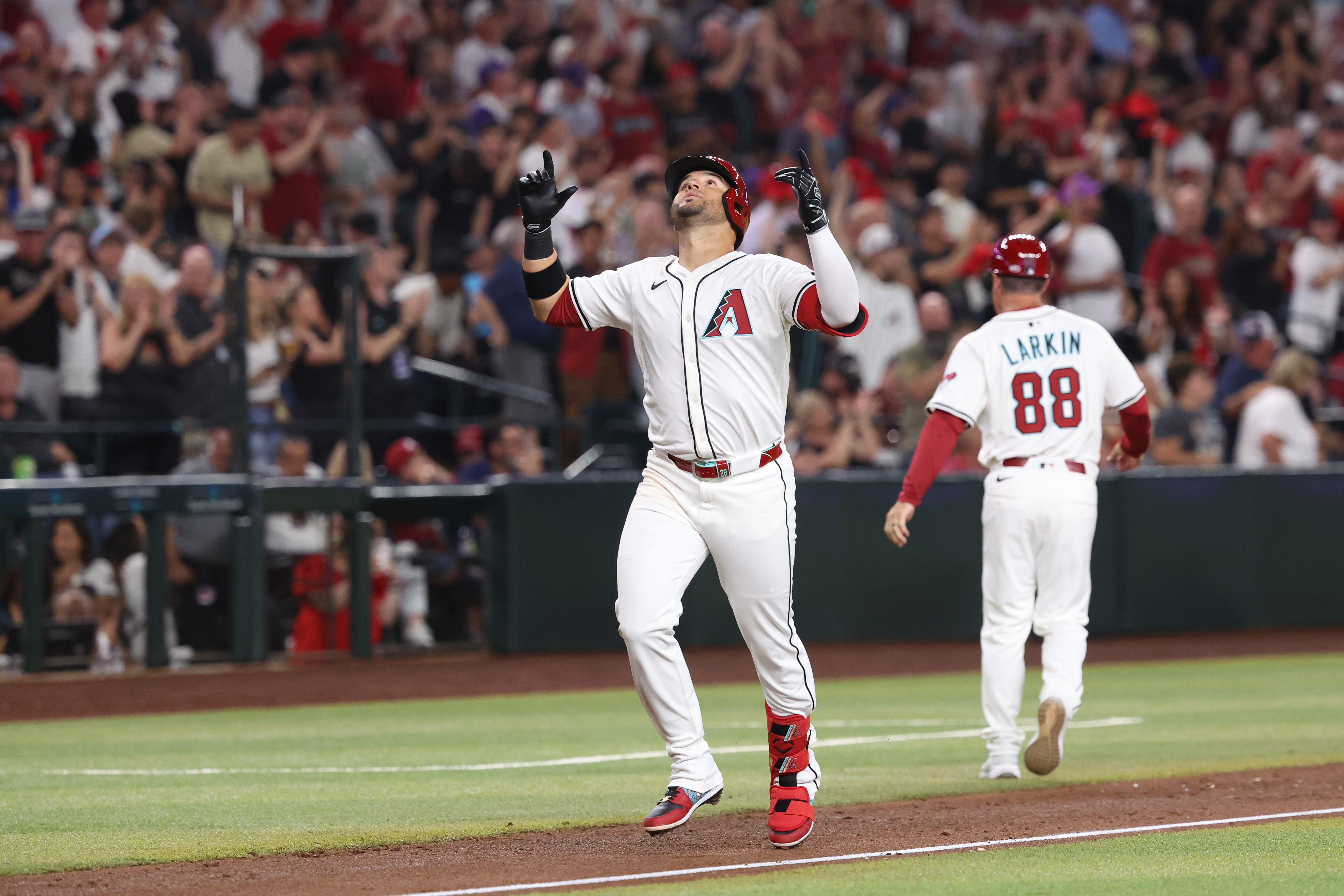 PHOENIX, AZ - MARCH 27: Eugenio Suárez #28 of the Arizona Diamondbacks celebrates as he rounds the bases after hitting a solo home run in the second inning during the game between the Chicago Cubs and the Arizona Diamondbacks at Chase Field on Thursday, March 27, 2025 in Phoenix, Arizona. (Photo by Chris Coduto/MLB Photos via Getty Images)