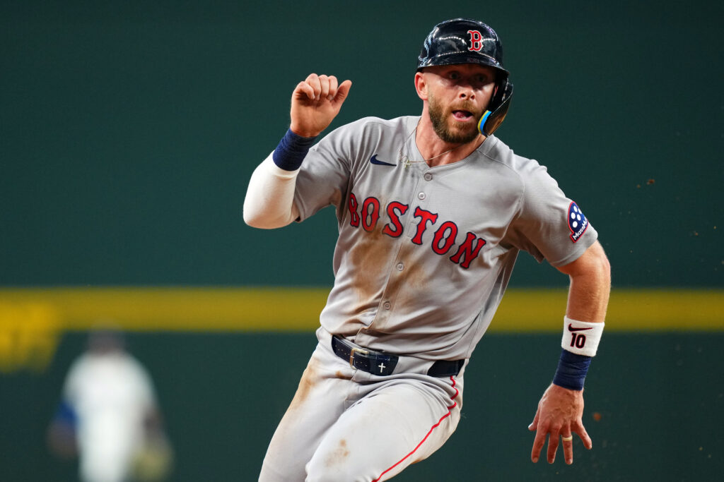 ARLINGTON, TX - MARCH 27: Trevor Story #10 of the Boston Red Sox runs to third base in the ninth inning during the game between the Boston Red Sox and the Texas Rangers at Globe Life Field on Thursday, March 27, 2025 in Arlington, Texas. (Photo by Cooper Neill/MLB Photos via Getty Images)