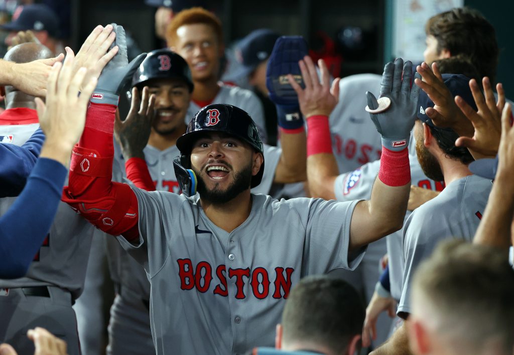 ARLINGTON, TEXAS - MARCH 27: Wilyer Abreu #52 of the Boston Red Sox celebrates in the dugout after hitting a two-run home run against the Texas Rangers in the ninth inning on Opening Day at Globe Life Field on March 27, 2025 in Arlington, Texas. (Photo by Richard Rodriguez/Getty Images)