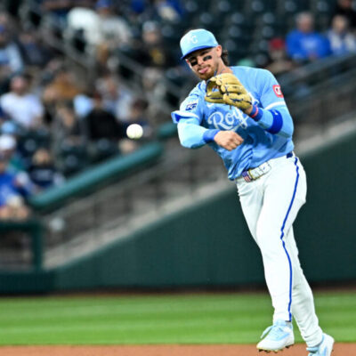 SURPRISE, ARIZONA - MARCH 05, 2025: Bobby Witt Jr. #7 of the Kansas City Royals throws to first base during the second inning of a spring training game against the Seattle Mariners at Surprise Stadium on March 05, 2025 in Surprise, Arizona. (Photo by David Durochik/Diamond Images via Getty Images)