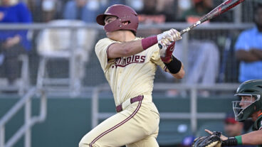 FSU infielder Alex Lodise hits a single in the first inning as the Miami Hurricanes faced the Florida State Seminoles at Mark Light Field at Alex Rodriguez Park.